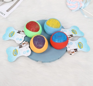 Detail of four squeaky dog balls with bone texture and dual-color拼接 patterns for pets