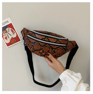 Detailed close-up of brown snakeskin pattern waist bag with silver zipper and strap