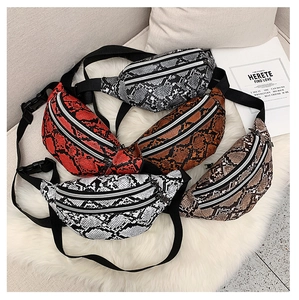 Detailed collection of snakeskin pattern waist bags in five colors on faux fur background