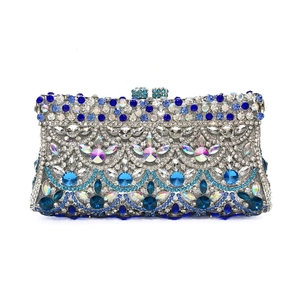 Macro view of blue and silver rhinestones and gemstone clasp on formal evening clutch