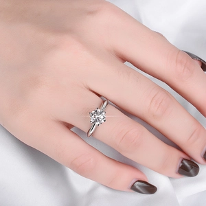 Detailed view of s925 sterling silver ring with classic six-prong moissanite setting