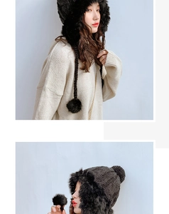 Detail of thick knit beanie with long tassel pom-poms and warm faux fur lining