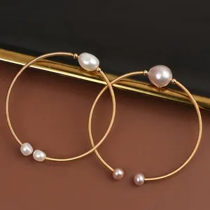 Handmade gold wire-wrapped open cuff bracelet with natural freshwater baroque pearls