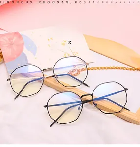 Detail of geometric metal eyeglass frames with anti-blue light coating in a minimalist style