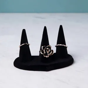 Three-piece ring set with black velvet display stand and 3D rose crystal jewelry design