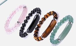 Detail of four natural stone bracelets featuring aventurine and tiger eye on white background
