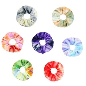 Set of seven colorful tie-dye velvet hair scrunchies with soft gradient fabric texture