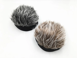 Detail showing creative wig caps in black-grey and light brown mixed hair textures
