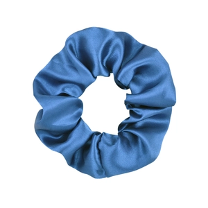 Detailed view of glossy blue satin fabric texture and pleated design on hair scrunchie