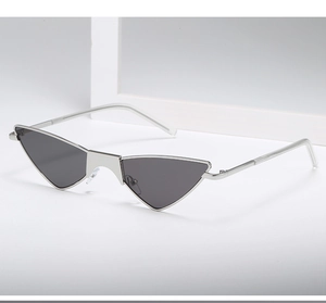 Side view of trendy silver metal cat-eye sunglasses with sharp triangular dark lenses