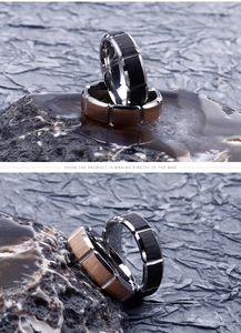 Detailed view of polished stainless steel rings with black and bronze brushed inlays