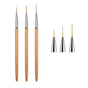 Detailed view of three professional nail art liner brushes with fine fiber tips and champagne gold handles