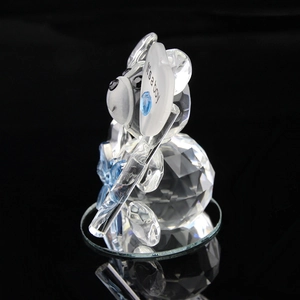 Detail of crystal bear figurine holding It's a boy heart for baby shower gift