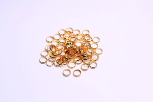 Macro shot of 14k gold plated metal spacer rings for jewelry making and DIY crafts