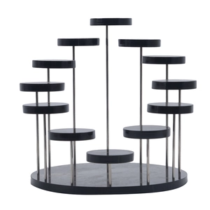Detail of a 12-tier black acrylic jewelry display stand with adjustable round metal risers