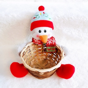 Close-up of cute penguin plush bamboo basket for Christmas candy and festive home decor