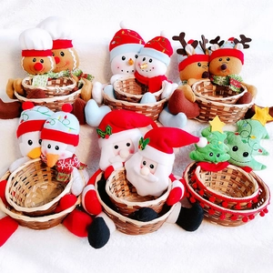 Collection of Christmas character bamboo baskets with Santa and Snowman for holiday candy storage