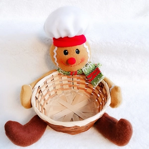 Detail of gingerbread man bamboo storage basket with red and green fabric accents