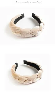 Detail view of the braided beige velvet headband with a high-quality woven texture