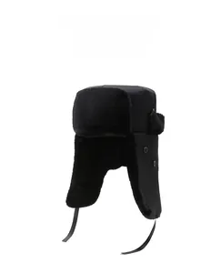 Detail of winter trapper hat featuring thick black faux fur lining and ear flaps