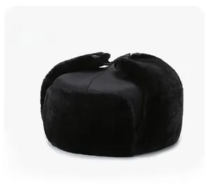 Side view detail of a black trapper hat with thick faux fur lining for winter warmth