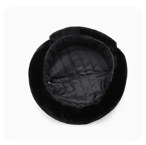 Inside view of black winter hat with quilted lining and thick faux fur trim detail