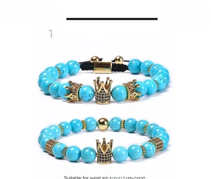 Detail of 8mm turquoise stone bead bracelets with CZ micro-pave crown charms