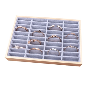Wooden jewelry display tray with 24 ice gray velvet slots for bracelets and bangles