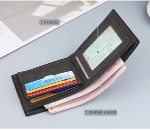 Detail of dark grey wallet with contrast stitching and secure zipper layer pocket