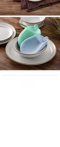 Detail of reusable TPE silicone dishwashing brushes in mint green and light blue colors
