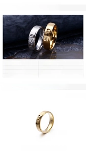Detail of 6mm stainless steel DAD rings in gold and silver finish on rock surface