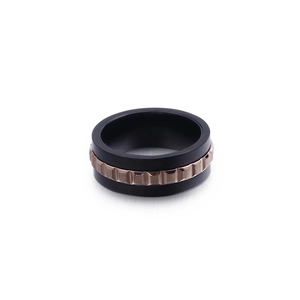 Men's titanium steel ring with black matte finish and rose gold gear-shaped center inlay
