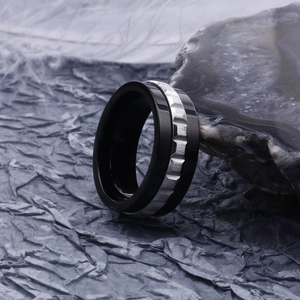 Modern black and silver stainless steel ring with textured gear pattern for men
