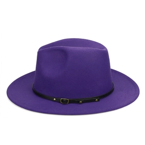Detail of a dark purple wool fedora featuring a slim black leather strap with gold buckle