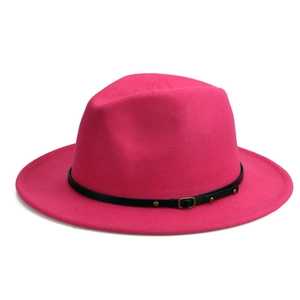 Detail of rose red wool fedora hat with black leather strap and golden buckle accent