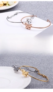 Close-up of butterfly bracelet showing vacuum plating finish and micro-set cubic zirconia