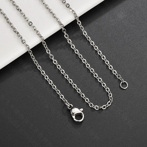 Detail view of silver stainless steel cable chain with a secure lobster clasp