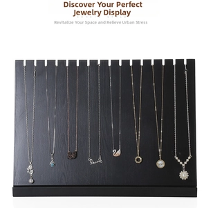 Detail of a black solid wood necklace display stand with 12 slots for jewelry storage