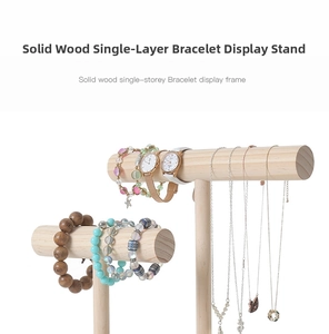 Macro shot of two wooden T-bar jewelry stands for watches and bracelets