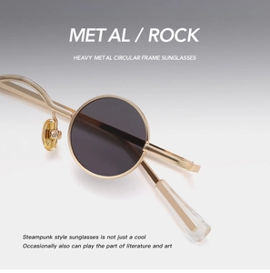 Detail of steampunk metal round sunglasses frame featuring golden bridge and nose pads