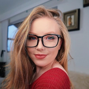 Detailed close-up of stylish black oversized square glasses frames worn by a model