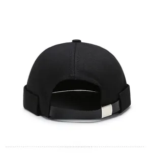 Rear view of black docker cap featuring adjustable leather strap and silver metal buckle