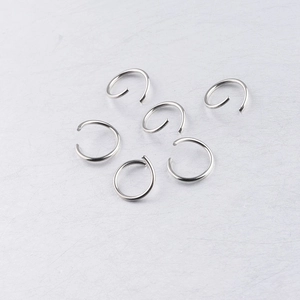 Macro view of polished silver stainless steel jump rings for DIY jewelry making