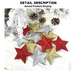 Close-up of glittery red, gold, and silver star ornaments with pine cones for Christmas