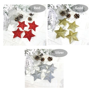 Three sets of glittery Christmas star ornaments in red, gold, and silver finishes