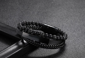 Close-up of multilayer leather bracelet with 6mm tiger eye beads and black magnetic clasp