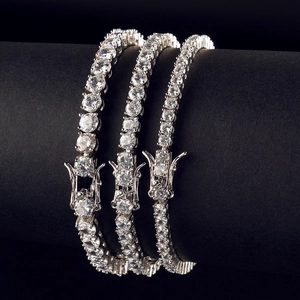 Three rows of 3mm-5mm tennis bracelets with cubic zirconia stones on a black display
