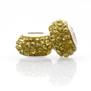Macro shot of sparkling yellow crystal bead with large hole for DIY jewelry making