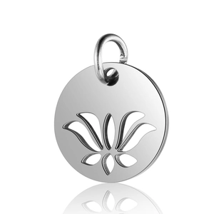 Macro shot of silver stainless steel circular pendant with hollow lotus flower pattern