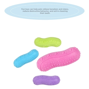 Detail of peanut-shaped dog chew toys in vibrant colors with raised texture and paw prints